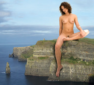 breasts collage nude mega barefoot ocean brunette sitting legs coast curly_hair cliff