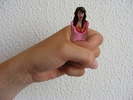 collage black_hair handheld scared hand shrunken_woman captured fist