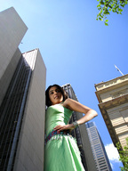 giantess collage city black_hair sky sunny point_of_view green_dress hands_on_hips