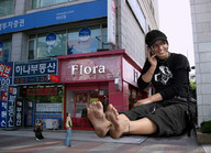 giantess collage barefoot sitting dirty_soles cellphone filming baseball_cap