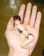 collage swimsuit handheld brunette asian short_hair hand shrunken_woman captured