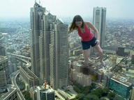 giantess collage city brunette shorts looking_down skyscrapers top raised_foot
