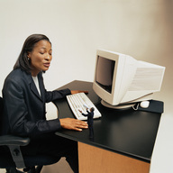 collage black_hair shrunken_men sitting dark_skin chair desk business_woman business_man computer mega_phone looking_at_tiny