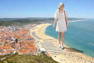 giantess collage city blonde beach ocean dress shadow walking looking_down coast sky crowds docop taylor_swift