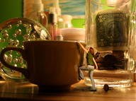 collage clothed climbing jeans brunette reaching shrunken_woman jar cup green_top money