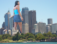 giantess collage city black_hair skyscrapers sky skirt_jeans blue_top behind_view