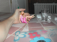 collage blonde high_heels sitting hand legs shrunken_woman pink_dress