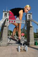 giantess collage blonde high_heels legs bending_over ankle_bracelet black_top looking_at_viewer plain_skirt draw_bridge on_bridge