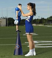 gentle giantess skirt brunette socks ponytail love cheerleader mini_giantess standing holding sneakers cone sports cheerleader_outfit top looking_at_tiny