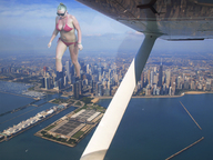 collage city mega blonde swimsuit water looking_down sunglasses skyscrapers clouds sky