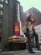 giantess collage city gloves sitting people curly_hair jessica_alba white_dress looking_at_viewer heeled_boots thigh_high_boots