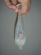 breasts collage nude cum giant condom red_hair hand shrunken_woman captured