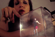 collage shrunken_woman entrapment captured prison glass_cube looking_at_tiny