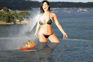 giantess collage swimsuit brunette smiling denise_milani looking_at_viewer wading firefighting_boat ocean_harbor