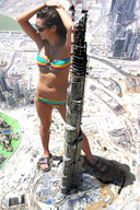 giantess collage city mega swimsuit brunette unknown_artist sandals burj_khalifa skyscraper sunglasses construction_site cranes looking_away