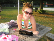 collage brunette phone sunglasses outdoors sunny bikini_top looking_at_viewer picnic_table shrunken_bus
