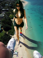 giantess black_hair swimsuit beach cleavage ocean celebrity walking sunglasses people coast kim_kardashian sunny point_of_view