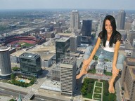 giantess collage city black_hair barefoot buildings jeans smiling sitting looking_at_viewer