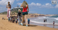collage size_difference clothed beach walking sand people giantesses behind_view light_house