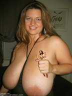 collage handheld shrunken_woman looking_at_viewer big_bare_breasts
