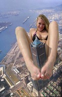 giantess collage city blonde toes barefoot buildings unknown_artist sitting sand river looking_at_viewer downward_angle