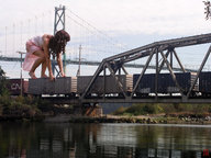 giantess landscape bridge brunette train dress kneeling jr highway river outdoors sky curly_hair balancing
