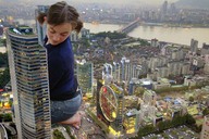 giantess collage city clothed barefoot unknown_artist kneeling looking_down skyscraper river downward_angle