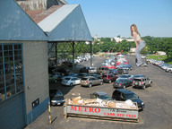 giantess collage blonde clothed buildings wonderslug vehicles under_foot parking_lot looking_at_viewer nikki_sims car_crush