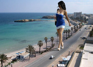 giantess collage clothed ocean buildings shoes unknown_artist walking highway vehicles palm_trees denise_milani seaside
