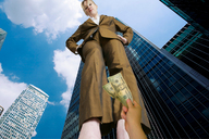giantess collage blonde clothed low_angle hand looking_down skyscraper shrunken_person point_of_view looking_at_tiny