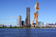 giantess collage city unknown_artist legs skyscrapers looking_at_viewer waterfront