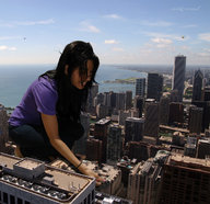 giantess collage city black_hair destruction clothed ocean buildings helicopter smiling squatting looking_down skyscraper nikemd crouching vandalism