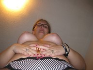 breasts low_angle shrunken_men hand looking_down point_of_view looking_at_viewer