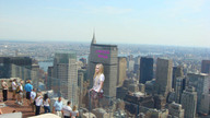 collage city blonde clothed unknown_artist avril_lavigne skyscrapers clothing spectators rooftop_view spray_paint giantess_rules
