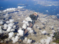 collage city mega blonde destruction high_heels wonderslug lying_down fishnets clouds looking_at_viewer downward_angle holly_mcguire