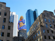 giantess collage city mega blonde skirt low_angle wonderslug supergirl looking_down skyscraper sky top belt between_buildings dc_comics bare_midriff