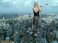 giantess collage city blonde clothed buildings helicopter hand standing clouds sky aerial_view taran kaley_cuoco