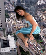 giantess collage feet city clothed barefoot traffic buildings brunette unknown_artist kneeling streets vehicles between_toes looking_back downward_angle
