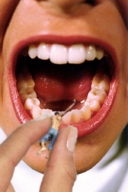 collage shrunken_men open_mouth lipstick implied_vore pinched no_shirt jean hand_heald mouth_shot