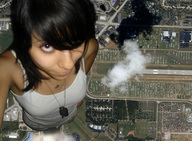 giantess collage city mega black_hair clothed clouds outdoors birds_eye_view dog_tags