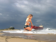 giantess collage blonde swimsuit beach ocean wonderslug kneeling waves sand clouds sky ships light_house newcastle natalia_paris