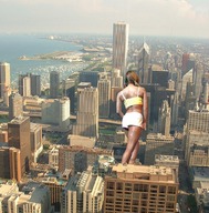 giantess collage city brunette unknown_artist walking boats skyscrapers between_buildings rooftop_view waterfront behind_view