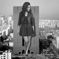 giantess collage city monochrome long_hair clothed skirt high_heels buildings brunette skyscraper