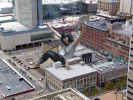 giantess collage city black_hair clothed barefoot buildings sitting parking_lot pacmanri