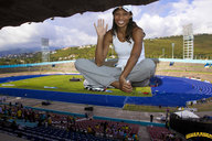 collage smiling sitting wave dark_skin field looking_at_viewer spectators baseball_cap lowerrider track_field stands