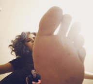 barefoot brunette low_angle shrunken_men sole looking_down foot_pov point_of_view