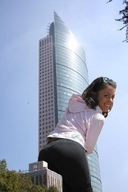 giantess collage clothed buildings brunette low_angle skyscraper sunglasses looking_at_viewer behind_view giulio_10