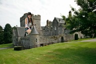 giantess collage clothed buildings smiling sitting grass trees looking_at_viewer zed782