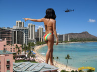 breasts giantess collage mega black_hair swimsuit beach ocean buildings helicopter sand dark_skin sky resort pointing behind_view beach_goers lowerrider
