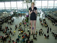 giantess collage blonde clothed wonderslug dress legs shrunken_people indoors airport terminal passport